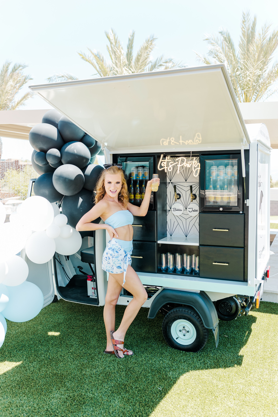 a person posing in front of an ice cream truck