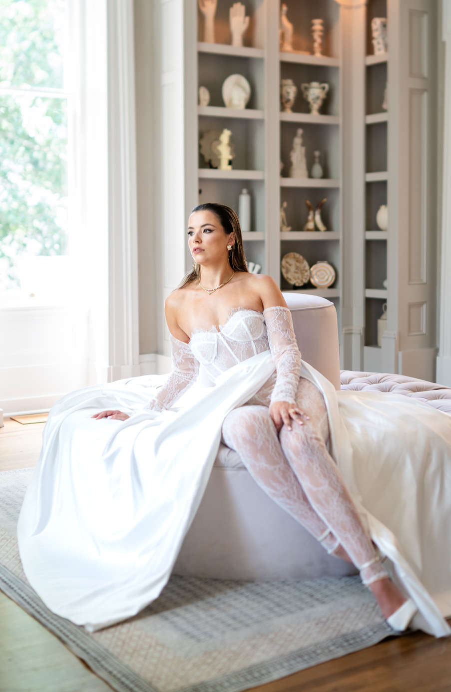 A person in a wedding dress sitting on a couch